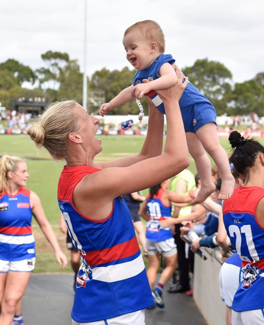 Lauren with her nephew at an AFLW game