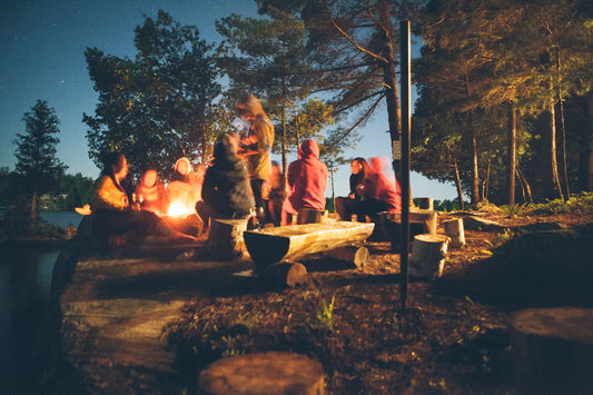 Camping under the trees family fire