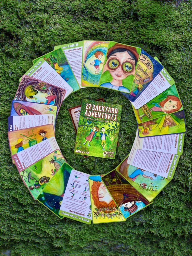 Circular arrangement of children's adventure cards and story cards entitled'22 Backyard Adventures' on a green textured background.