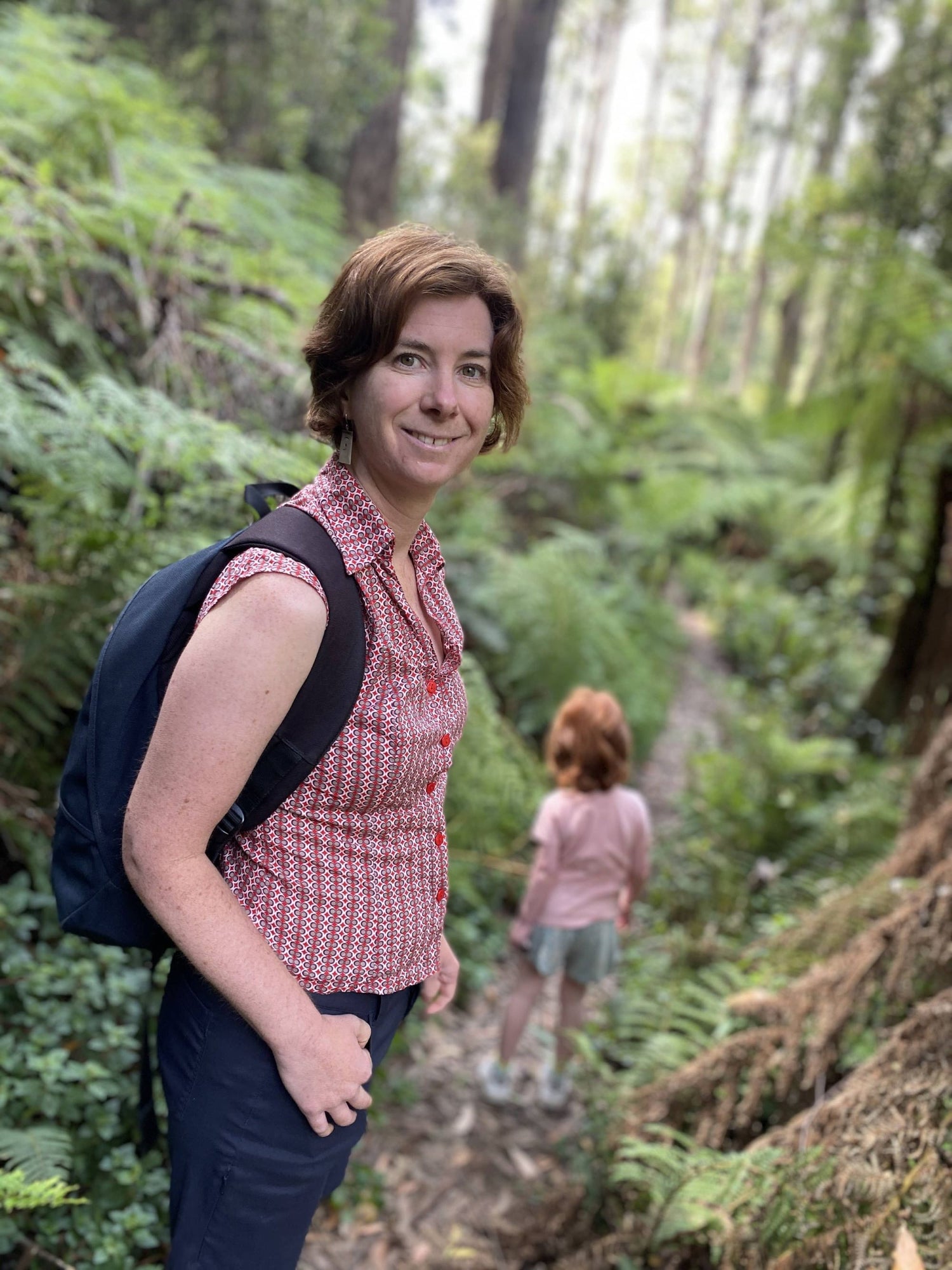 Christina and her daughter on a trail exploring